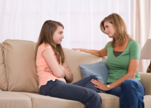 Mother talking with daughter about divorce.