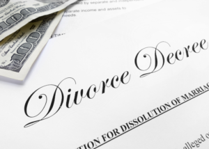 Money sitting on top of divorce decree.