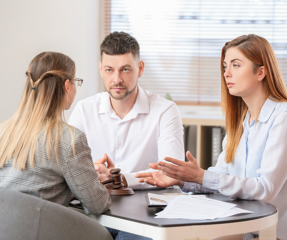 Couple talking with divorce lawyer