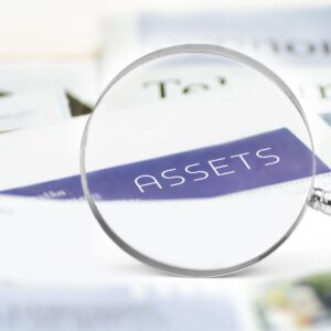 Magnifying glass over the word assets