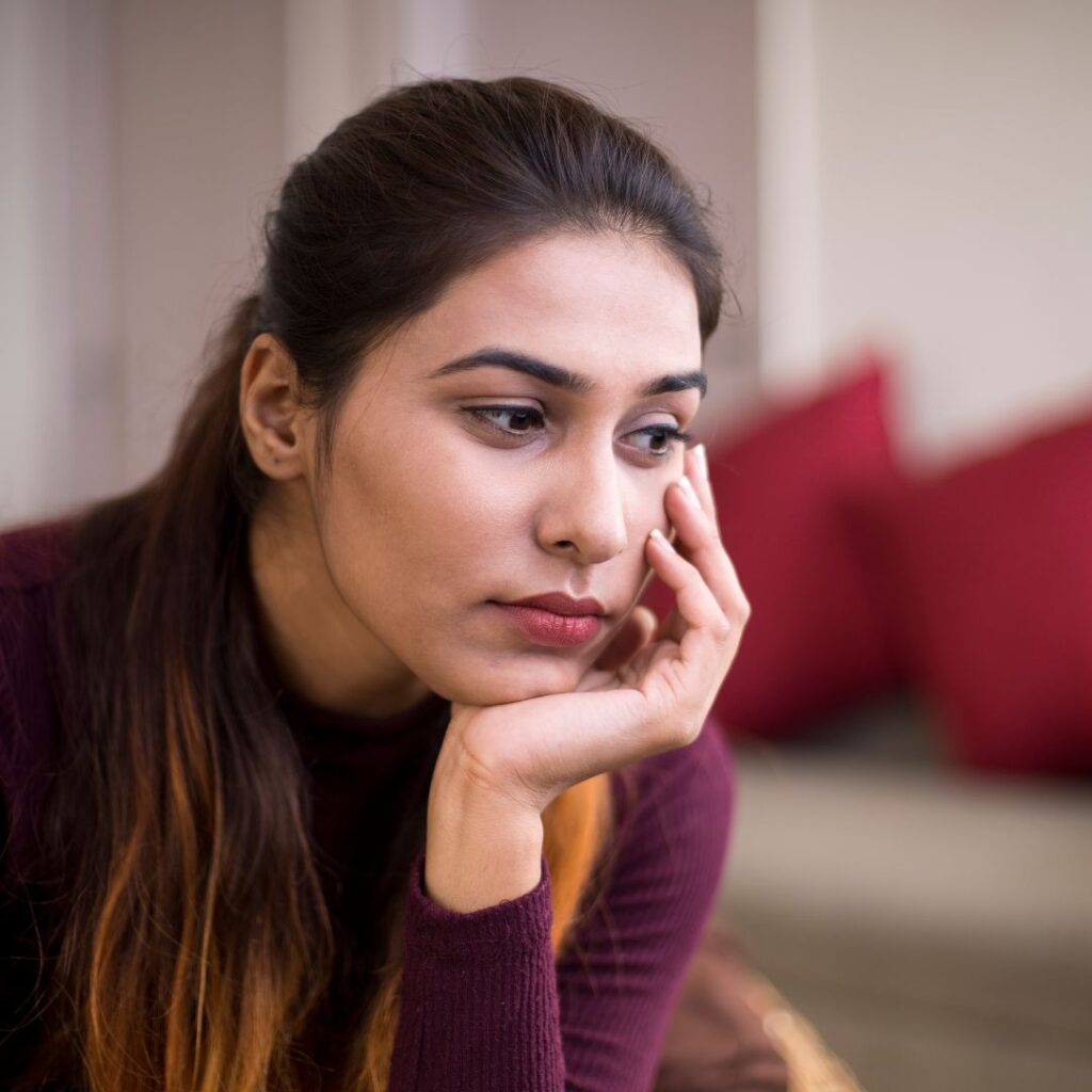 Sad woman sitting and thinking